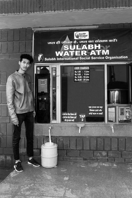 A local resident collecting safe drinking water from the Water ATM in Sulabh campus in South-West district, National Capital Territory of Delhi